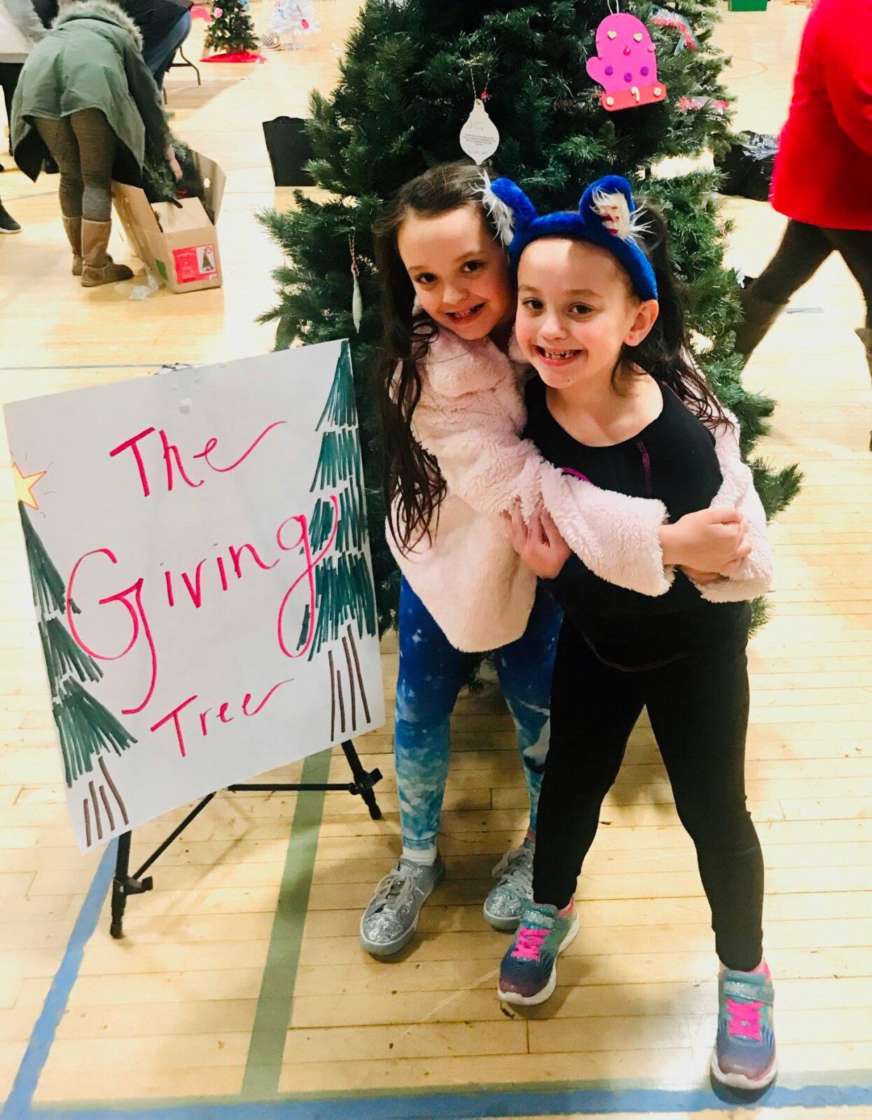 The giving tree girls smiling